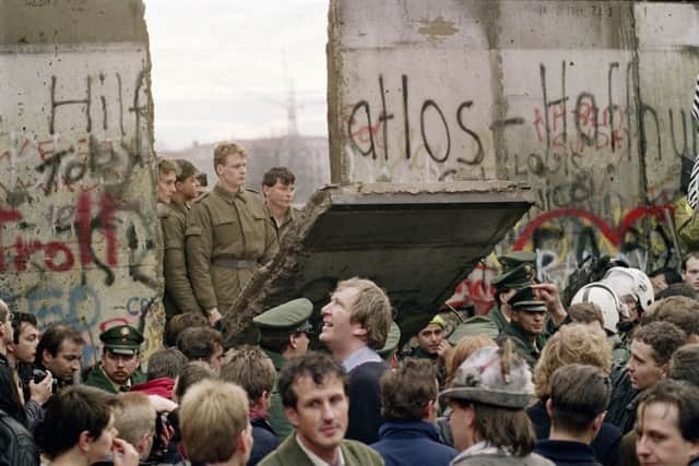 On this day in 1989 around 100,000 East Germans poured through the Berlin Wall, which was being destroyed to create crossing points. Picture: AFP