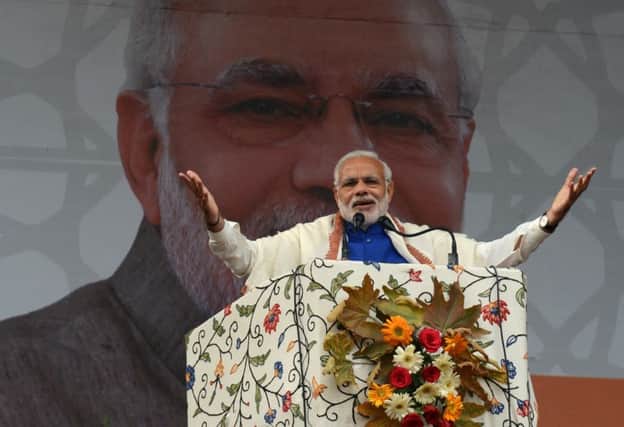 Modi addresses a rally in India.  He faces demonstrations over anti-Muslim riots. Picture: Getty