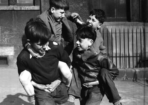 Children at Play - Cuddie Fight Tron Square, April 1954 . Norman Davidson battles with Tate Wilson while Billy Carty and Peter Bridges are the horses.
