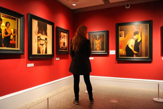 A visitor to Glasgow's Kelvingrove Art Gallery and Museum at a jack Vettriano exhibition. Picture: Robert Perry