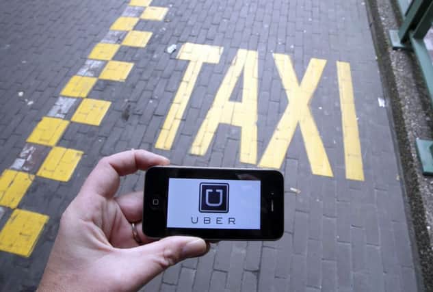 Uber has launched in Glasgow and Edinburgh this year. Picture: AFP/Getty Images