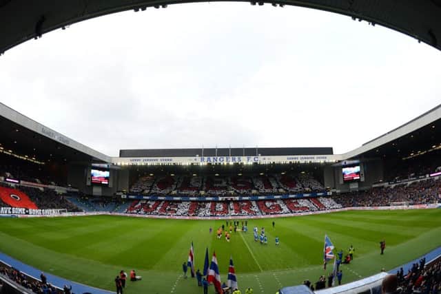 Rangers fans hold cards up ahead of kick-off on Remembrance weekend. Picture: SNS
