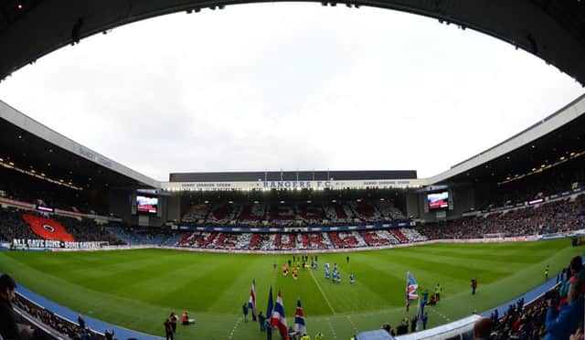 Rangers fans hold cards up ahead of kick-off on Remembrance weekend. Picture: SNS
