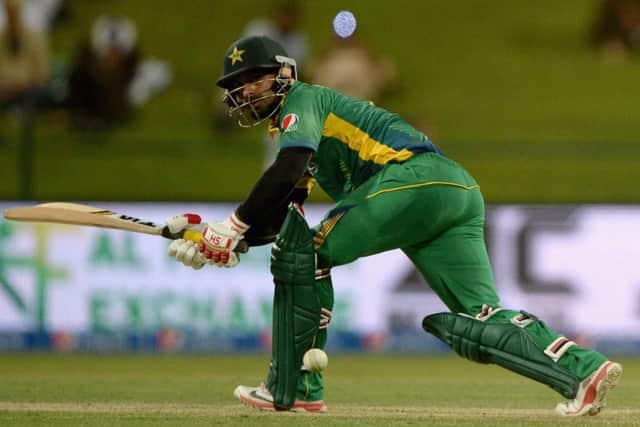 Mohammad Hafeez sweeps on his way to an unbeaten 102 as Pakistan won the first ODI in Abu Dhabi. Picture: Getty Images