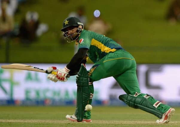 Mohammad Hafeez sweeps on his way to an unbeaten 102 as Pakistan won the first ODI in Abu Dhabi. Picture: Getty Images