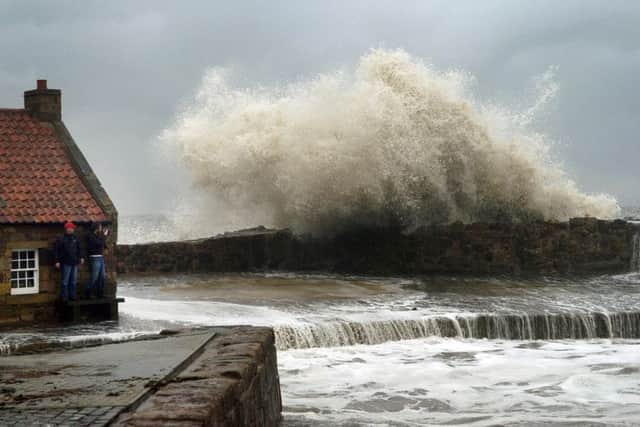 Waves crashing over the harbour wall in Pittenweem, Fife. Picture: Jane Barlow