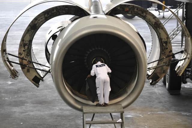 Engines maker Rolls-Royce is to cut management jobs after another profit warning. Picture: AFP/Getty