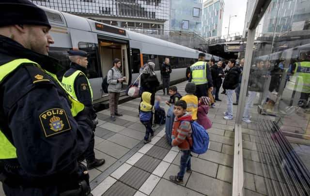Refugees arrive  in Malmo, at the Swedish end of the train journey from Denmark. Picture: AP