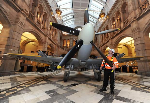 Spitfire LA198 is lowered to the ground for Amistice Day. Picture: John Devlin