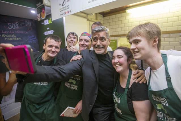 Selfie: George Clooney posing with Social Bite staff. Picture: Getty