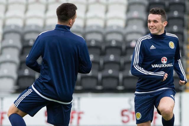 John McGinn stretches off at training ahead of the game against Ukraine Picture: SNS