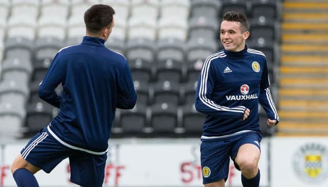 John McGinn stretches off at training ahead of the game against Ukraine Picture: SNS
