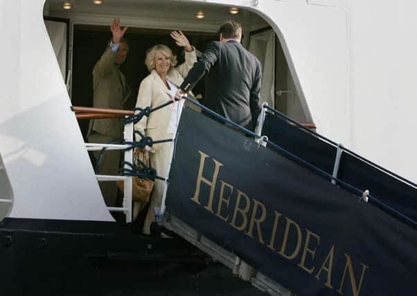 The Prince of Wales and Duchess of Cornwall wave as they board the Hebridean Princess boat at Kyle of Lochalsh to join the Queen on their summer holidays in 2006. Picture: Andrew Milligan/PA