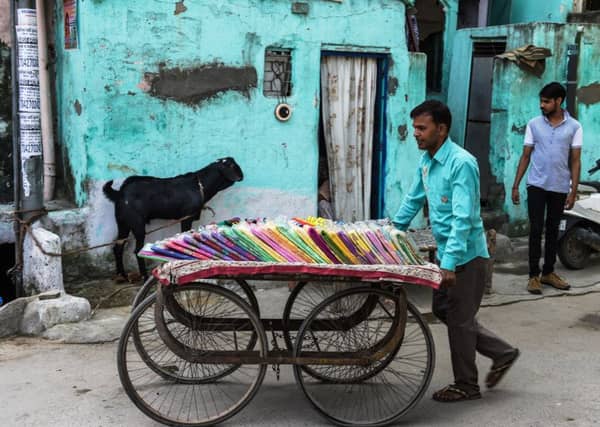 Despite their relative poverty, Indians are far more hopeful about what the future holds. Picture: AFP/Getty Images