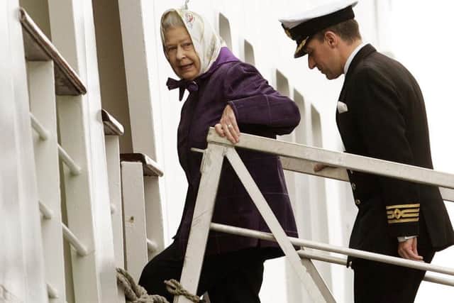 The Queen arrives with Captain Michael Hepburn to embark on the Hebridean Princess for a cruise to celebrate her 80th birthday in 2006. Picture: Andrew Milligan/PA