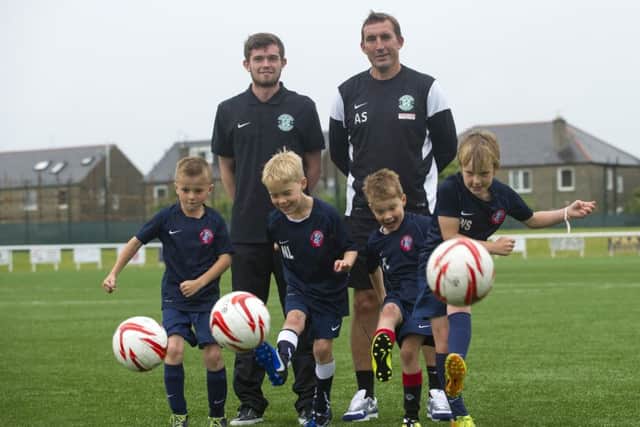 Hibs manager Alan Stubbs and player Sam Stanton promoted the partnership between the Championship club and the youth teams at Spartans. Picture: Lesley Martin