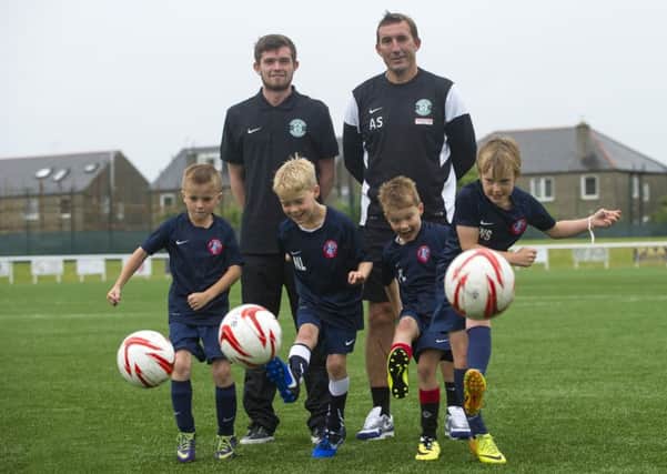Hibs manager Alan Stubbs and player Sam Stanton promoted the partnership between the Championship club and the youth teams at Spartans. Picture: Lesley Martin