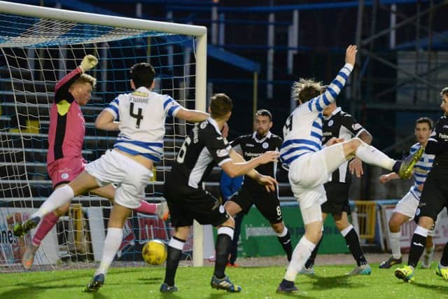 Mortons Denny Johnstone, fifth from left, scores a second goal for his side in the Championship clash with visitors Queen of the South. Picture: SNS Group
