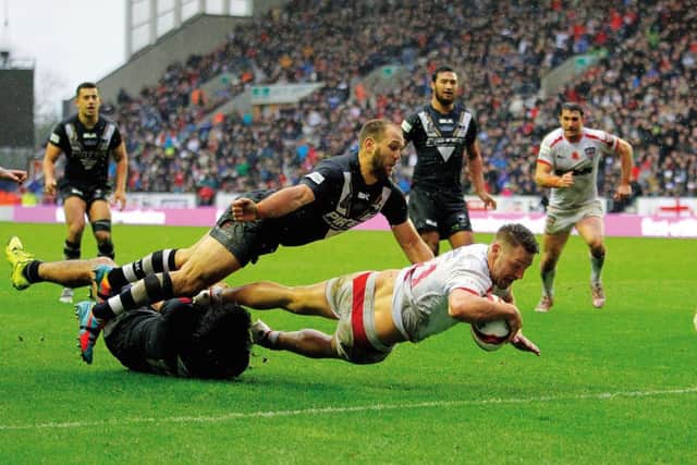 England's Elliott Whitehead scores a try during the International Test Series match at the DW Stadium, Wigan. Picture: PA