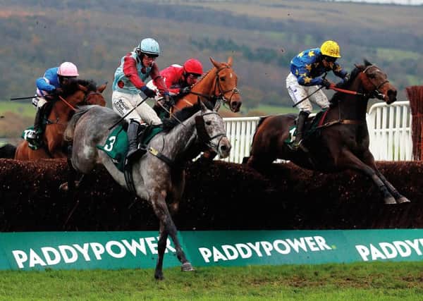 Irish Cavalier jumps the last in front but Annacotty and Ian Popham (yellow cap) prevailed. Picture: PA