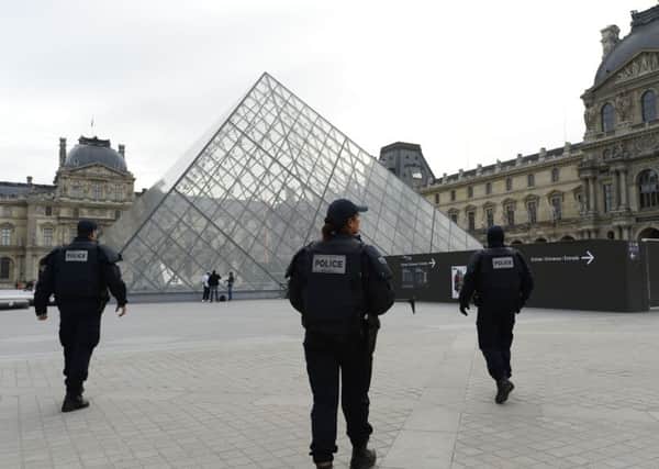 Police patrol  at the Louvre museum in Paris. Picture: AFP/Getty Images