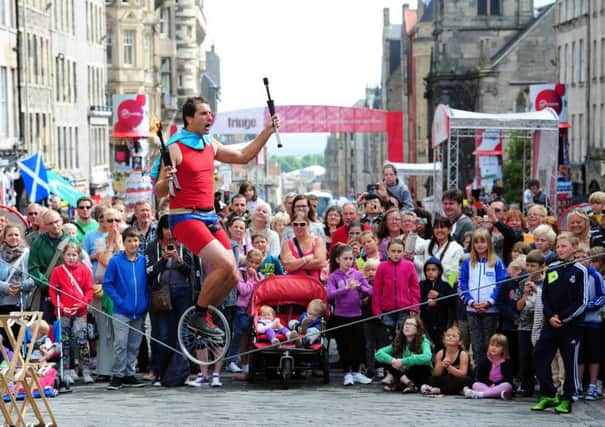 Street performers in a traffic-free  Royal Mile in Edinburgh. Picture: Ian Rutherford