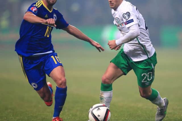 Republic of Irelands Wes Hoolahan, right, and Miralem Pjanic of Bosnia-Herzegovina battle for the ball in Fridays play-off first leg. Picture: PA