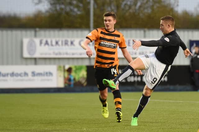 Falkirk's John Baird hammers home his hat-trick. Picture: SNS Group