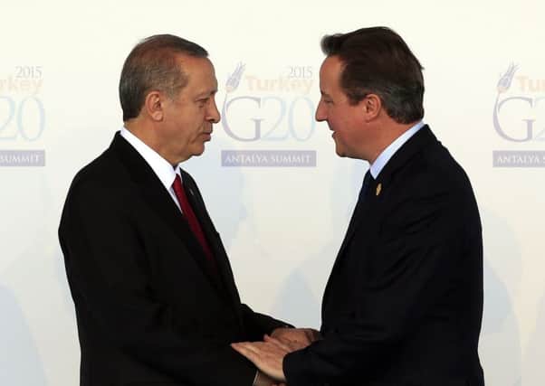 Recep Tayyip Erdogan welcomes David Cameron, at the G-20 summit in Antalya, Turkey. Picture: AP