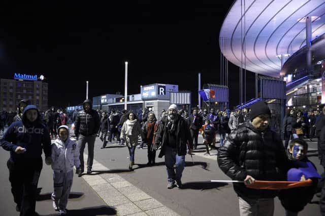 Supporters leave the Stade de France after the match. Picture: Getty