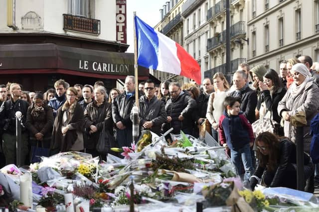 People observe a minute of silence . Picture: Getty