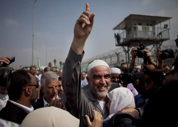 Sheik Raed Salah, the leader of the Northern Branch of the Islamic Movement in Israel, gestures to supporters. Picture: AP