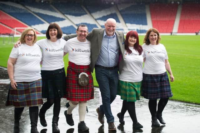Sir Tom Hunter joins volunteers Marion Robinson, Moira Burke, Christopher Quinn, Izzy Conway and Lesley Sharp to launch Kiltwalk 2016. Picture: John Devlin