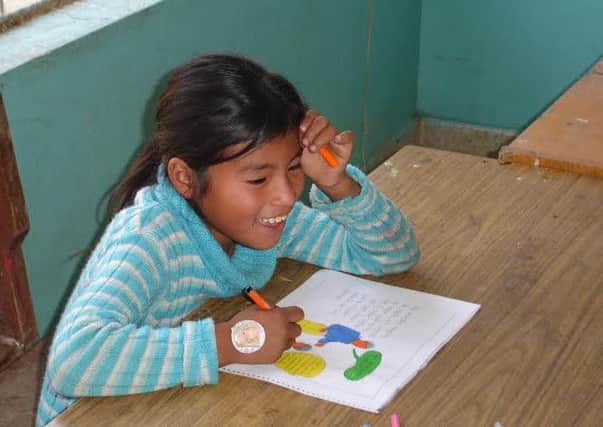 A schoolgirl in Lima, Peru, where ChildHope is securing safe school environments for pupils thanks to a six-figure donation from Aberdeen Asset Management