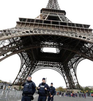 Police officers patrol at the Eiffel Tower. Picture: AP