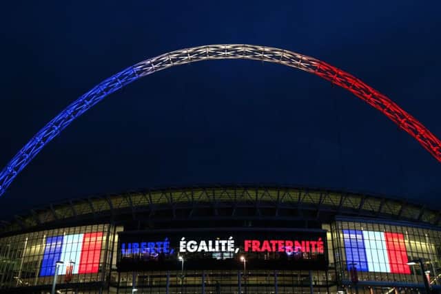 Wembley stadium is lit up in the French Tricolore in remembrance to the victims of last weeks terror attacks in Paris. Picture: Getty