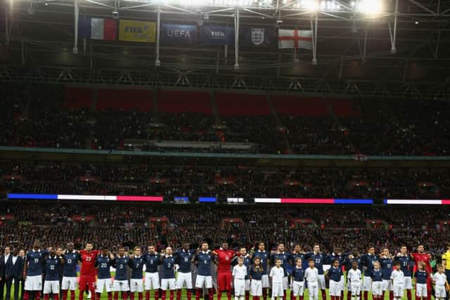 French players lined up as the stadium joined together to sing the national anthem. Picture: Getty