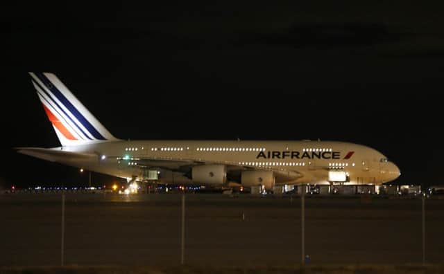 Air France Flight 65,  sits on the runway at Salt Lake City International Airport as FBI officers investigate the plane. Picture: Getty