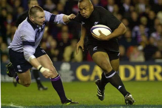 Jonah Lomu evades the challenge of Scotland's James McLaren during the Autumn Test series in November 2001. Picture: Ian Rutherford