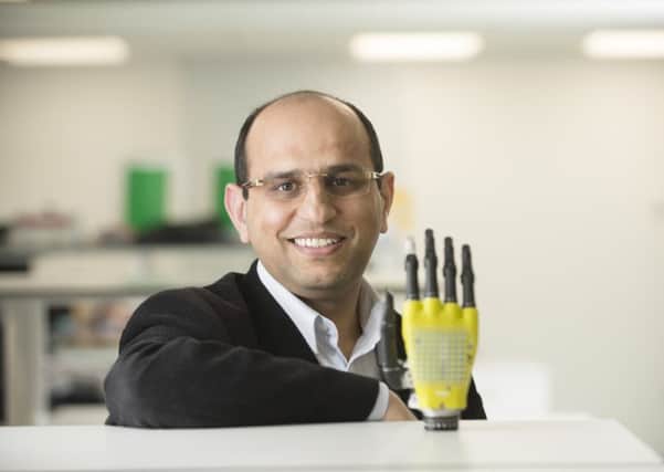 Dr Dahiya with his prototype prosthetic hand from the University of Glasgow