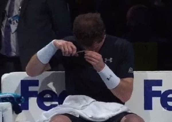Murray chops away at his locks between games. Picture: Sky Sports