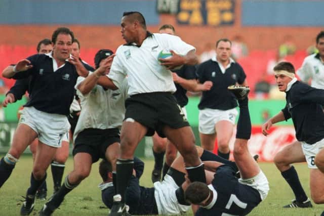 Iain Morrison, left, facing Jonah Lomu in Scotland's quarter-final against the All Blacks in 1995. Picture: Colin Elsey