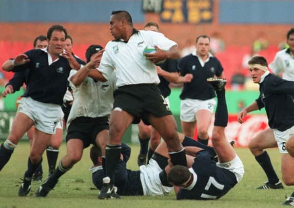 Iain Morrison, left, facing Jonah Lomu in Scotland's quarter-final against the All Blacks in 1995. Picture: Colin Elsey