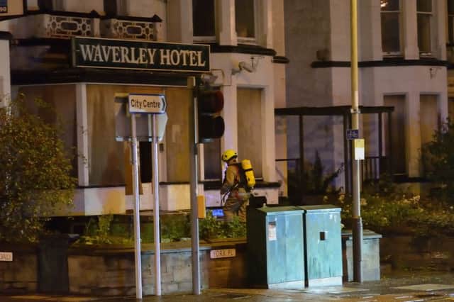 A firefighter outside the Perth hotel owned by Ann Gloag. Picture: Stuart Cowper
