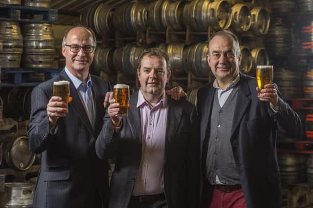 From left, John Hunt, David McGowan and Steve McCarney raise a glass to thyeir deal to putrchase Borders-based Broughton Ales, maker of Greenmantle and Old Jock. Picture: Contributed