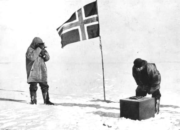 Norwegian explorer Captain Roald Amundsen taking in the sights at the South Pole beside the Norwegian flag. Picture: Illustrated London News/Getty Images