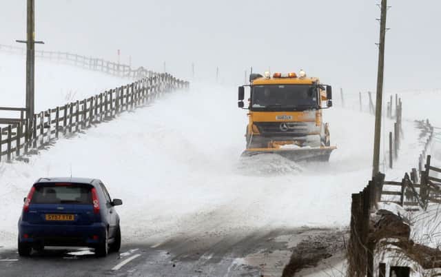 A motorist faces a snowy A823 in Fife. Picture: Hemedia