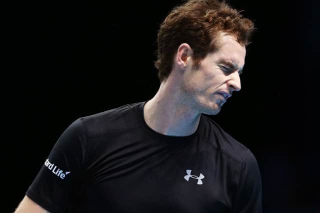 Andy Murray cuts a frustrated figure during his 7-6, 6-4 defeat by Stan Wawrinka at the ATP World Tour Finals in London last night. Picture: Getty