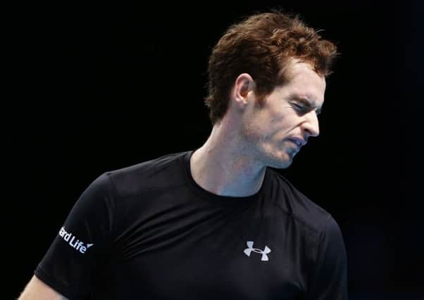 Andy Murray cuts a frustrated figure during his 7-6, 6-4 defeat by Stan Wawrinka at the ATP World Tour Finals in London last night. Picture: Getty