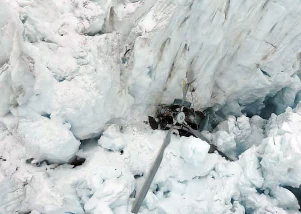 The helicopter wreckage can be seen on the Fox Glacier. Picture: Getty